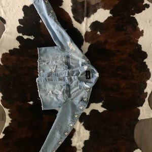 Cropped denim jacket with stars up the sleeves